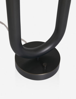 Close-up of the base of the Happy black, oil-rubbed bronze table lamp by Regina Andrew with a dual-metal tube silhouette with contrasting matte white bumbs