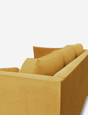 Outer corner of the Hollingworth Goldenrod Velvet sectional sofa