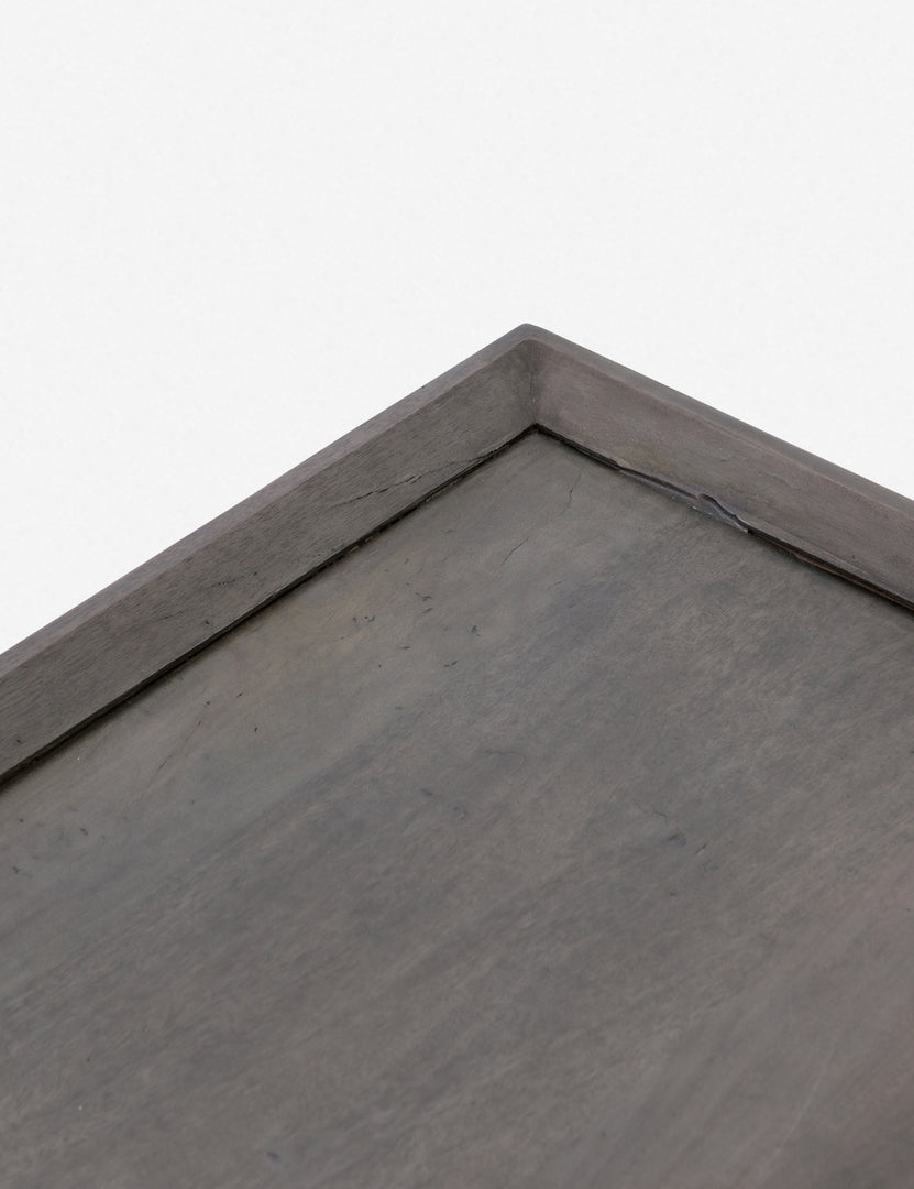 | Close-up of the corner and walled border of the Alison geometric square coffee table