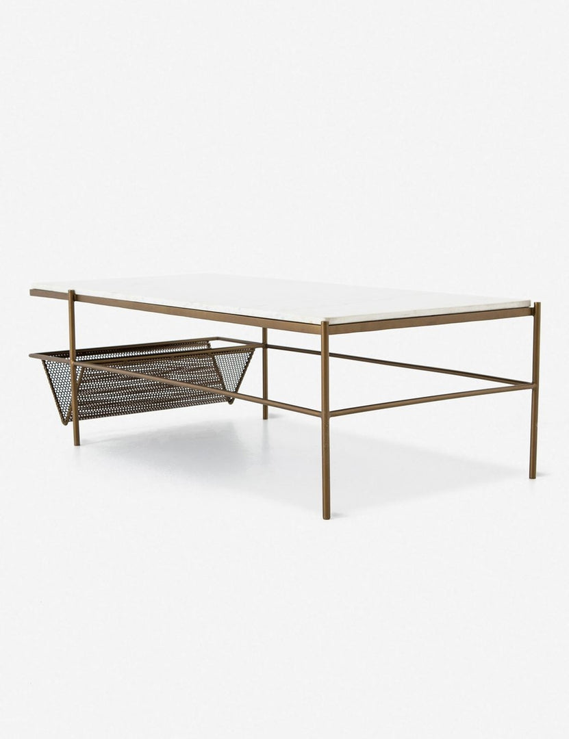 | Angled view of the Thina rectangular marble coffee table with gold hardware and magazine shelf