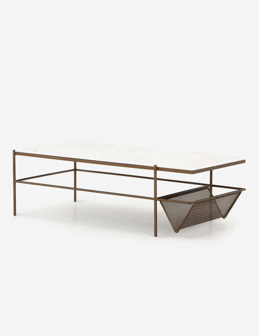 | Angled view of the Thina rectangular marble coffee table with gold hardware and magazine shelf