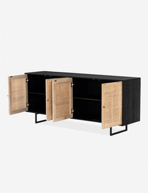 All four cane doors open on the Hannah black mango wood sideboard with cane doors and an iron base, revealing the inner shelving.