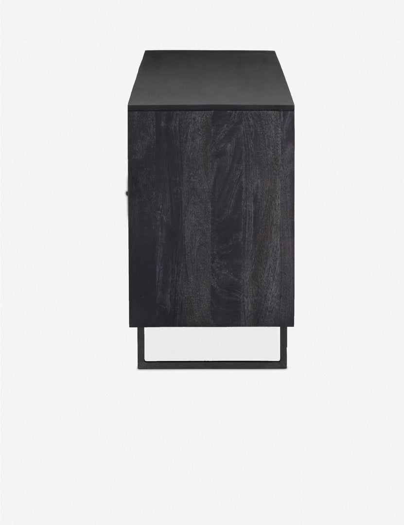 #color::black | Side view of the Hannah black mango wood sideboard with cane doors and an iron base.