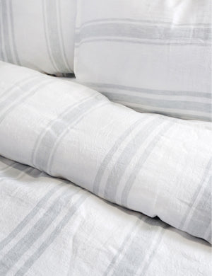 Detailed shot of the Jackson Linen white and ocean striped Duvet by Pom Pom at Home