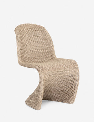 Angled view of the Manila wicker weave beige indoor and outdoor dining chair