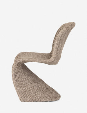Side view of the Manila wicker weave beige indoor and outdoor dining chair