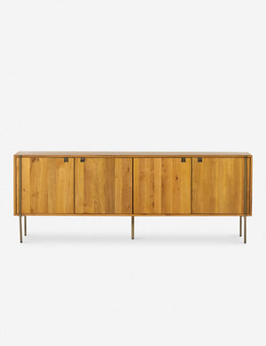 Karma Oak wooden Sideboard featuring cutout details and thin brass legs