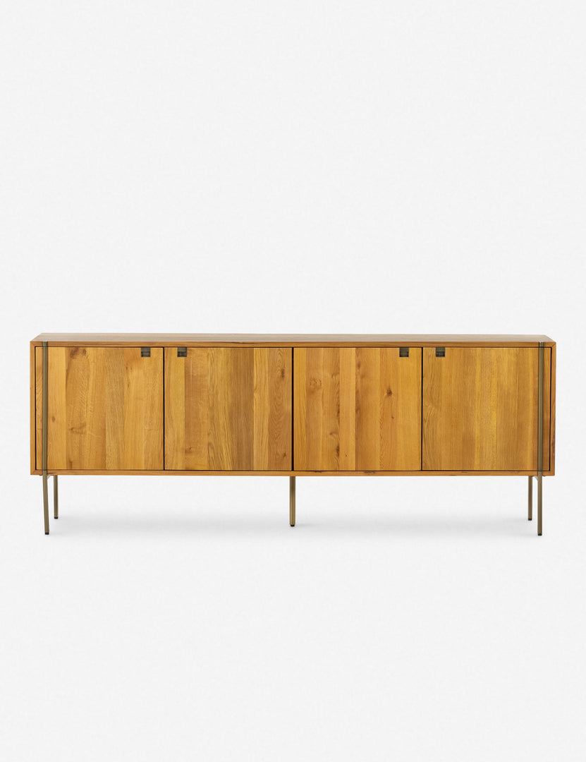 | Karma Oak wooden Sideboard featuring cutout details and thin brass legs