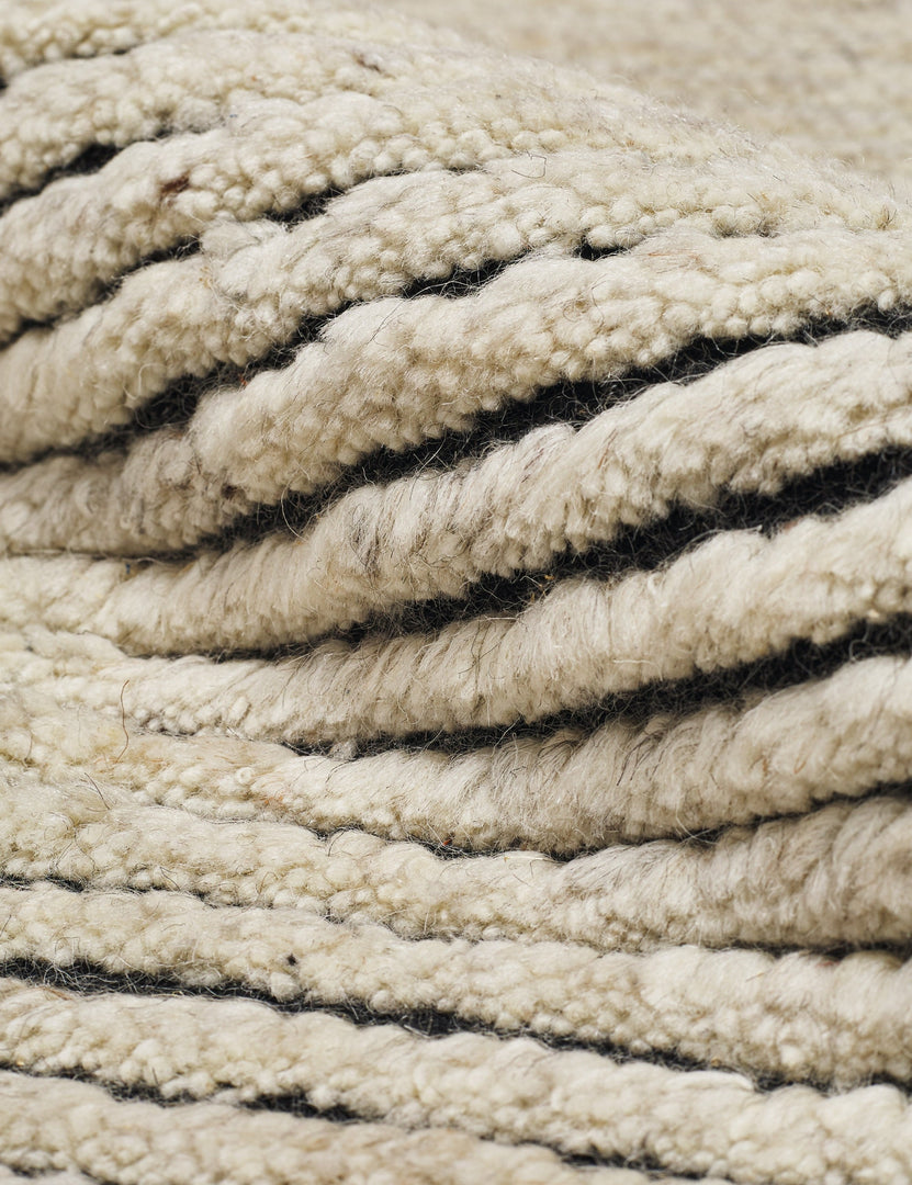 #size::6--x-9- #size::8--x-10- #size::9--x-12- #color::black-and-natural #size::10--x-14- | Close-up of the striped texture on the Kenzi black and natural rug