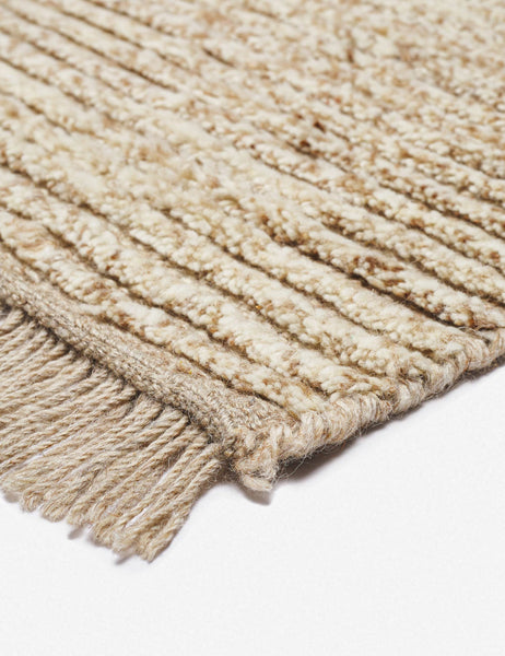 #size::6--x-9- #size::8--x-10- #size::9--x-12- #color::sand #size::10--x-14- | The fringe on the corner of the Kenzi sand rug