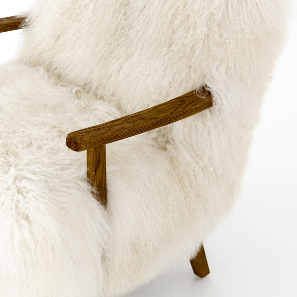 | Close-up of the wooden arm on the Kora accent chair