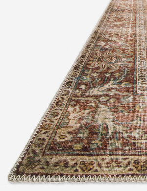 Angled close-up of the corner and edge of the Daelon persian and vintage inspired rug