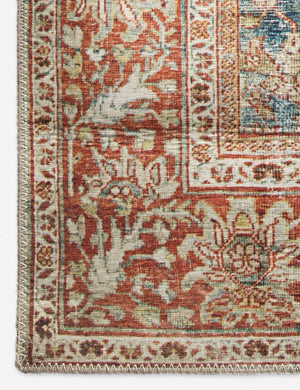 Close-up of the contrasting red and beige border on the Daelon persian and vintage inspired rug