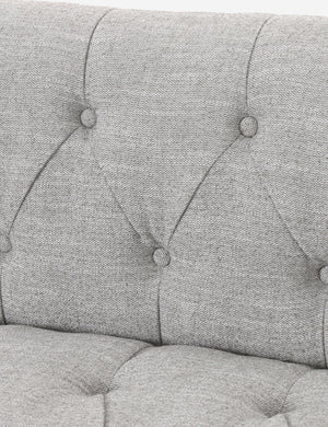 Close-up of the button tufted construction on the Leandra sofa