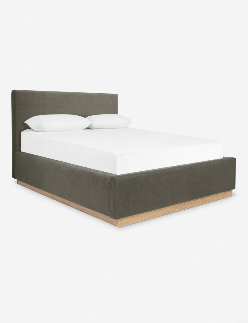 #color::loden #size::cal-king #size::king #size::queen | An angled side view of the Lockwood gray velvet-upholstered bed with a white oak base.