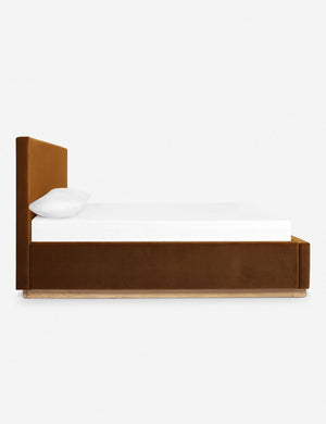 A side view of the Lockwood cognac velvet-upholstered bed with a white oak base.