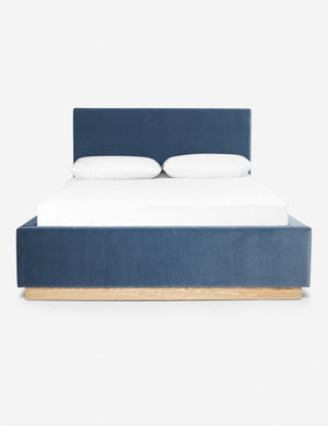 Lockwood blue velvet-upholstered bed with a white oak base.