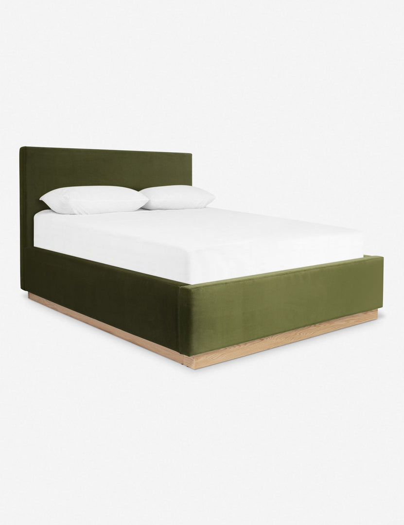 #color::jade #size::cal-king #size::king #size::queen | An angled side view of the Lockwood jade velvet-upholstered bed with a white oak base.