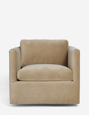 Lotte camel velvet swivel chair with a deep seat and shelter-style design