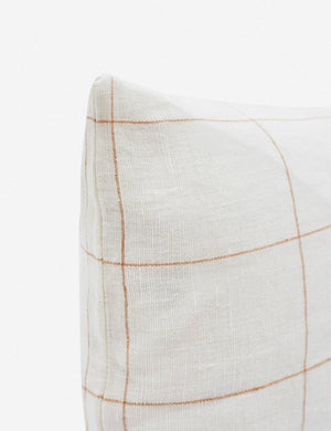 Corner of the Lucian white and rust lumbar pillow