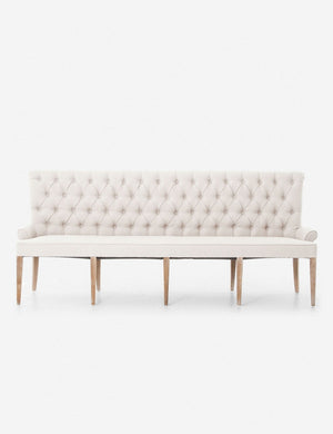 Lucita ivory Dining Bench with a button-tufted back and curved legs