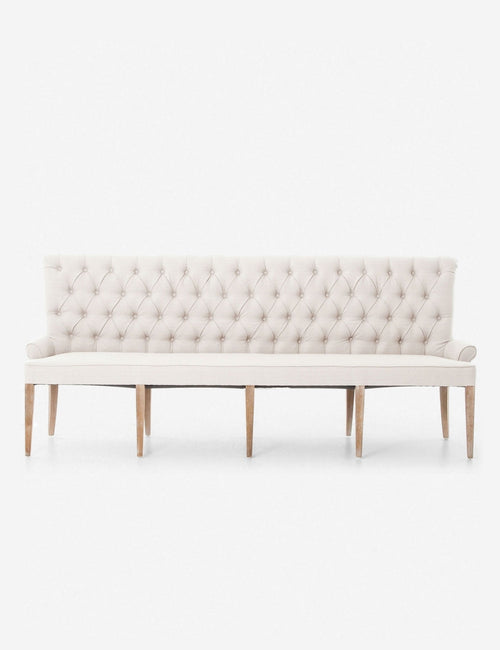| Lucita ivory Dining Bench with a button-tufted back and curved legs