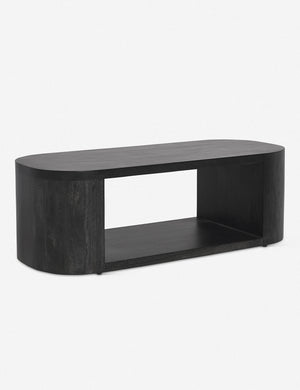Angled view of the Luna black wood oval coffee table.