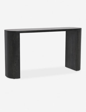 Angled view of the Luna black mango wood oval console table.