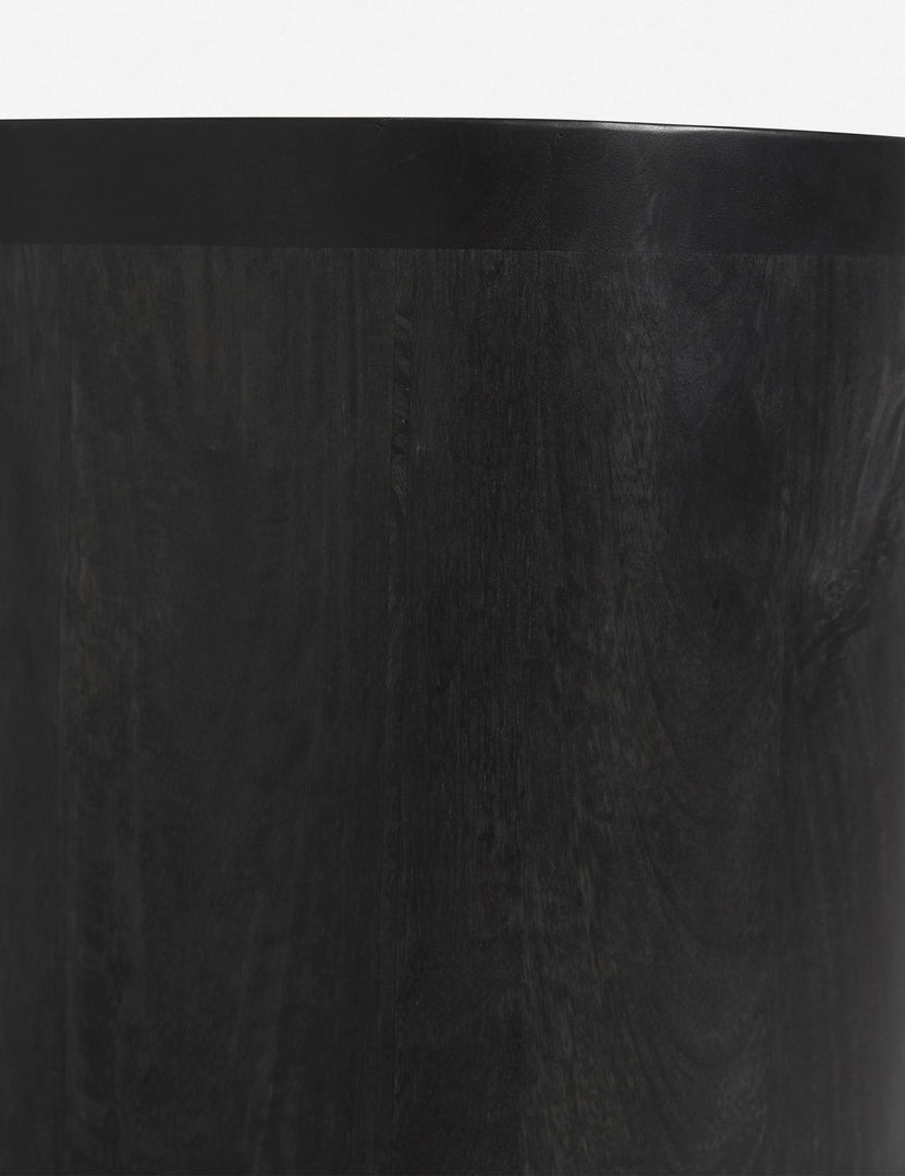 #color::black | Detailed shot of the black mango wood on the Luna black mango wood oval console table.