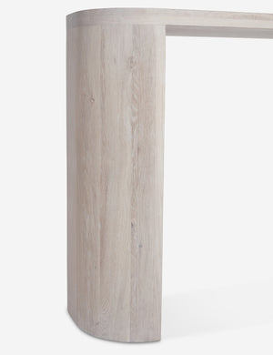 Close-up of the leg of the Luna white-washed oak oval console table.