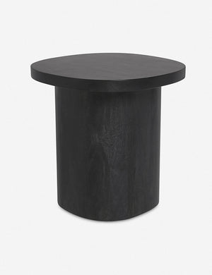 Angled view of the Luna black wood round side table