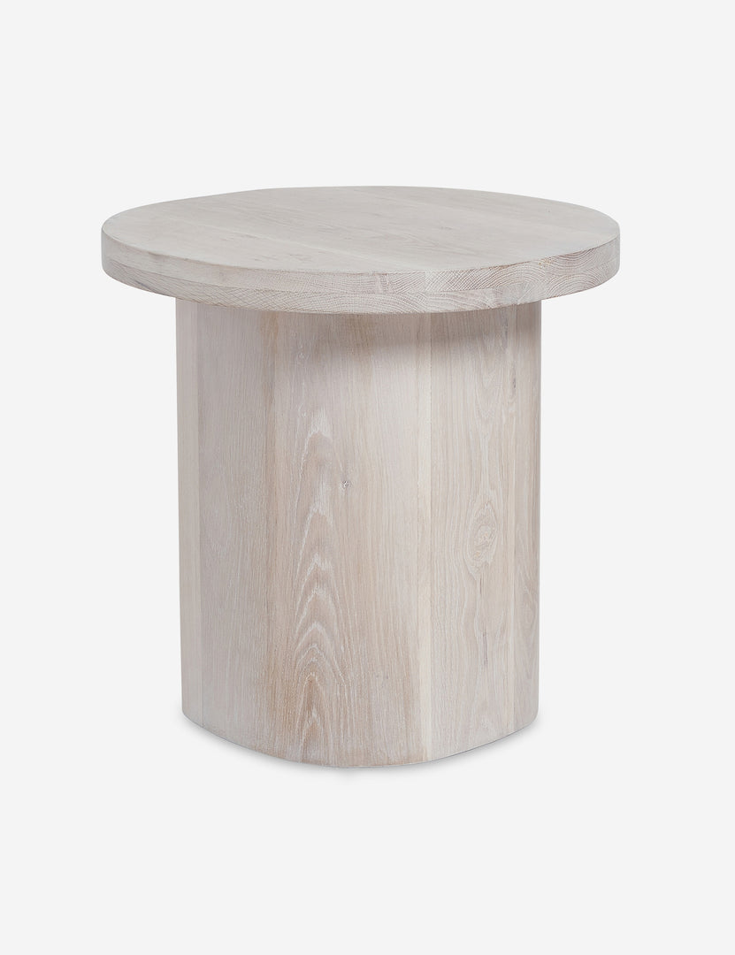 #color::washed-oak | Close-up of the rim of the top of the Luna washed-oak wood round side table and the leg