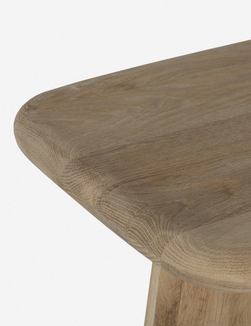 #color::natural | Close-up of the left corner on the Nera natural wood sculptural console table