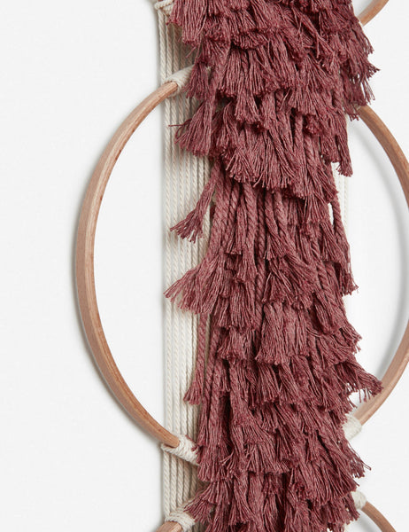 #color::brick | Close-up of the tasseled material on the Studio Nom Lwazi brick red woven Wall Hanging by nom