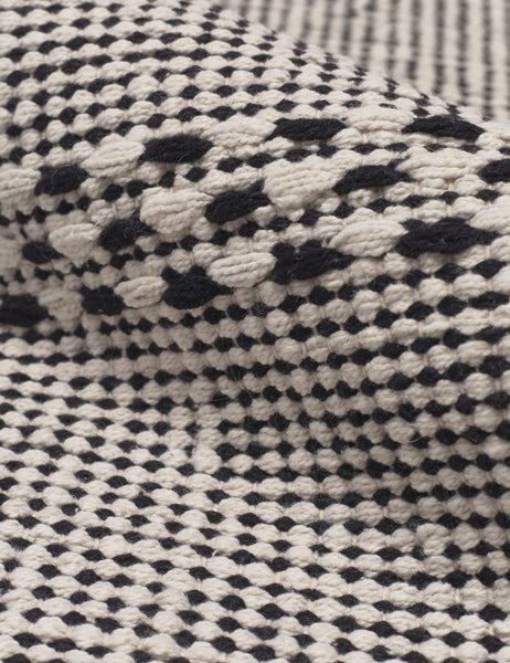 #size::1-9--x-2-10- #size::2--x-5- | Close-up of the Masha gray and black geometric machine washable mat