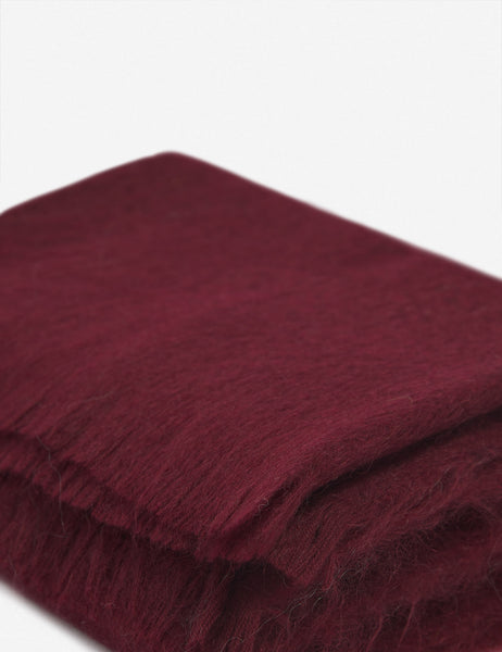 #color::merlot | Close-up of the Aimee mohair merlot burgundy wool throw blanket with fringe ends