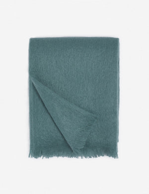 Aimee mohair blue wool throw blanket with fringe ends with the corner folded in