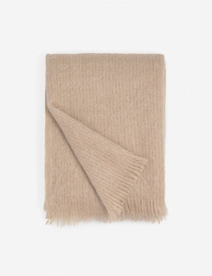 Aimee mohair blush wool throw blanket with fringe ends with the corner folded in