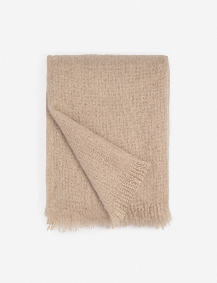 #color::blush | Aimee mohair blush wool throw blanket with fringe ends with the corner folded in