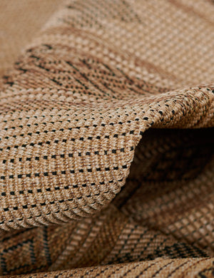 Close-up of the flatweave fabric on the Ember brown patterned indoor and outdoor rug