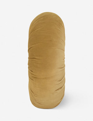Side view of the Monroe mustard yellow velvet round pillow