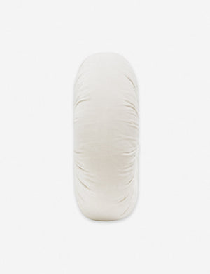 Side view of the Monroe oyster white velvet round pillow