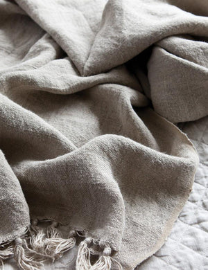 Close up of the Montauk natural linen blanket with tasseled ends by pom pom at home