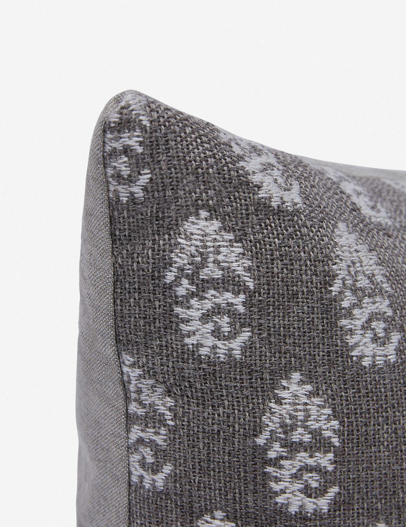 | Close-up of the corner of the Montrose Indoor and Outdoor gray, paisley patterned Lumbar Pillow by Sunbrella for Lulu and Georgia