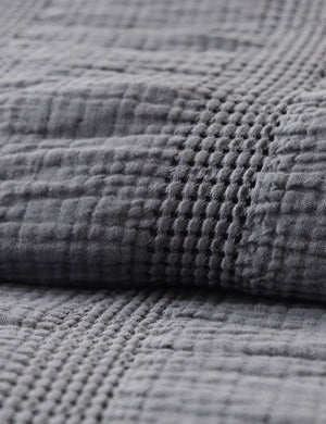 Close up of the Nantucket Cotton Matelassé midnight grey Coverlet by Pom Pom at Home