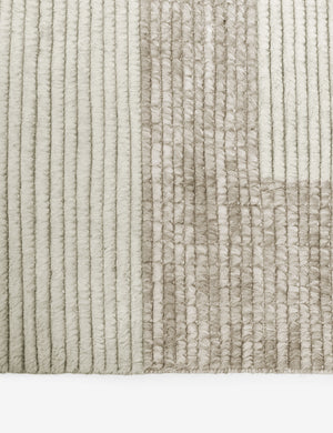 Close-up of the two-toned ribbed fabric on the Nomad neutral-toned geometric floor rug by Élan Byrd