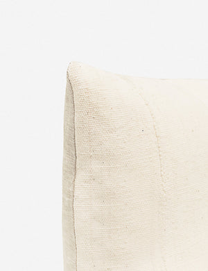The corner of the Norala solid white handmade square throw pillow