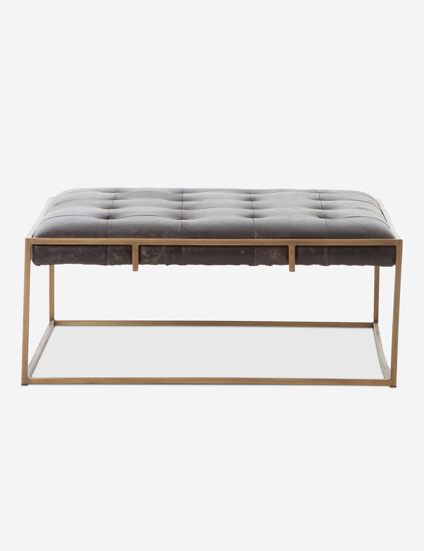 | Olwina Square Black Leather Coffee Table with a tufted finish and a brass-tone metal frame