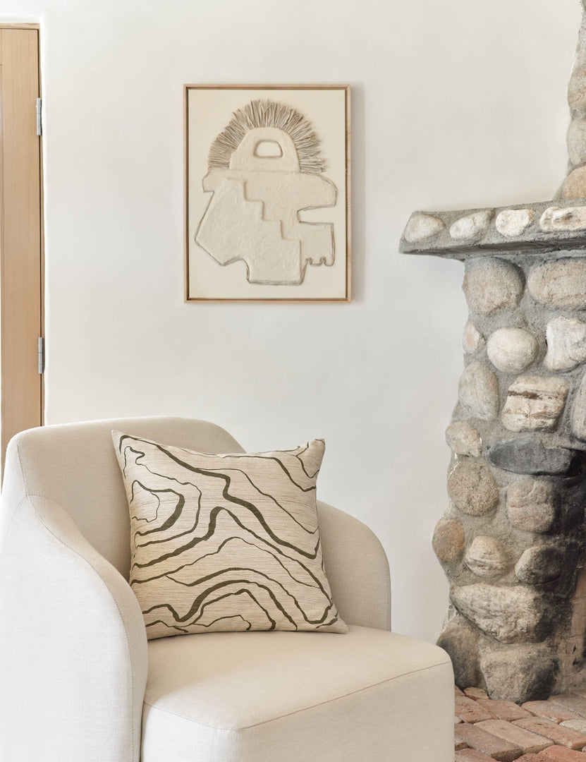 #color::olive #style::square | Canyon Olive Green Square Pillow sits on an ivory accent chair next to a stone fireplace