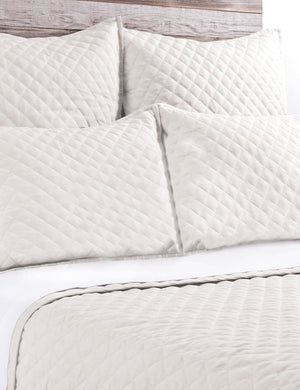 Close-up of the Hampton cream Quilted Coverlet by Pom Pom at Home